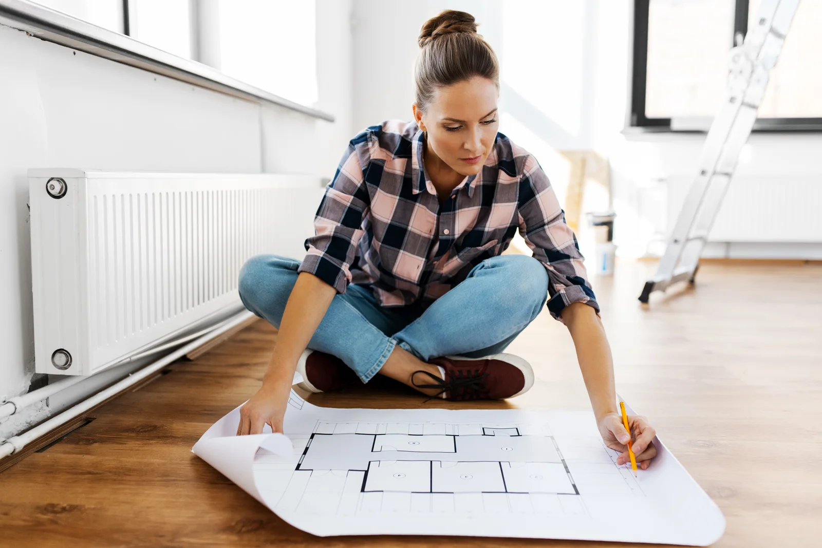 Person on floor with layout