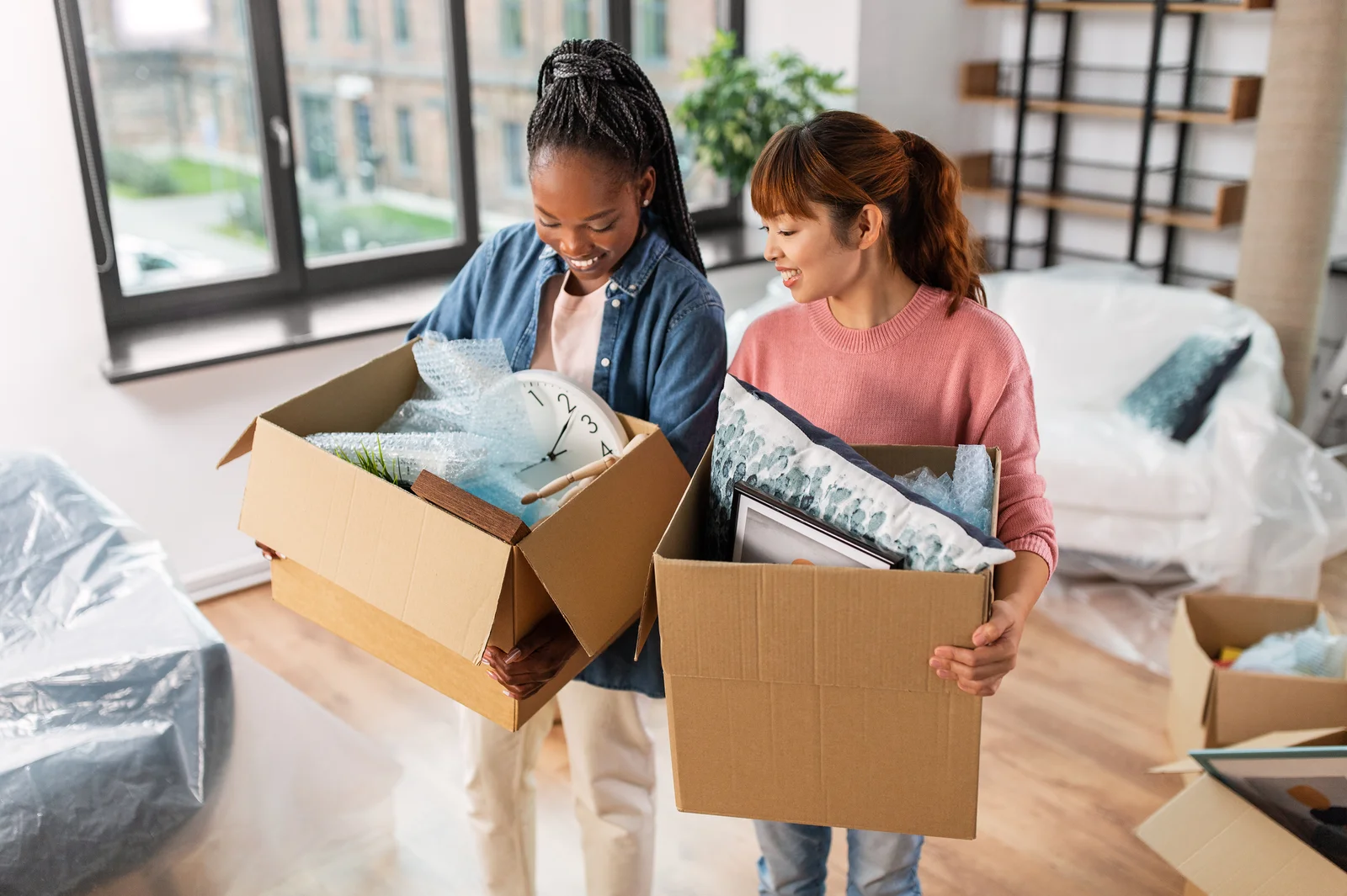 Women with boxes at new home