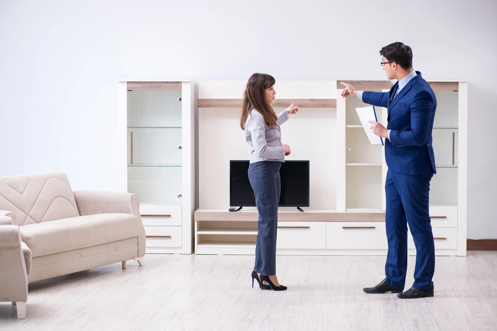 Real estate agent showing new apartment to owner 2