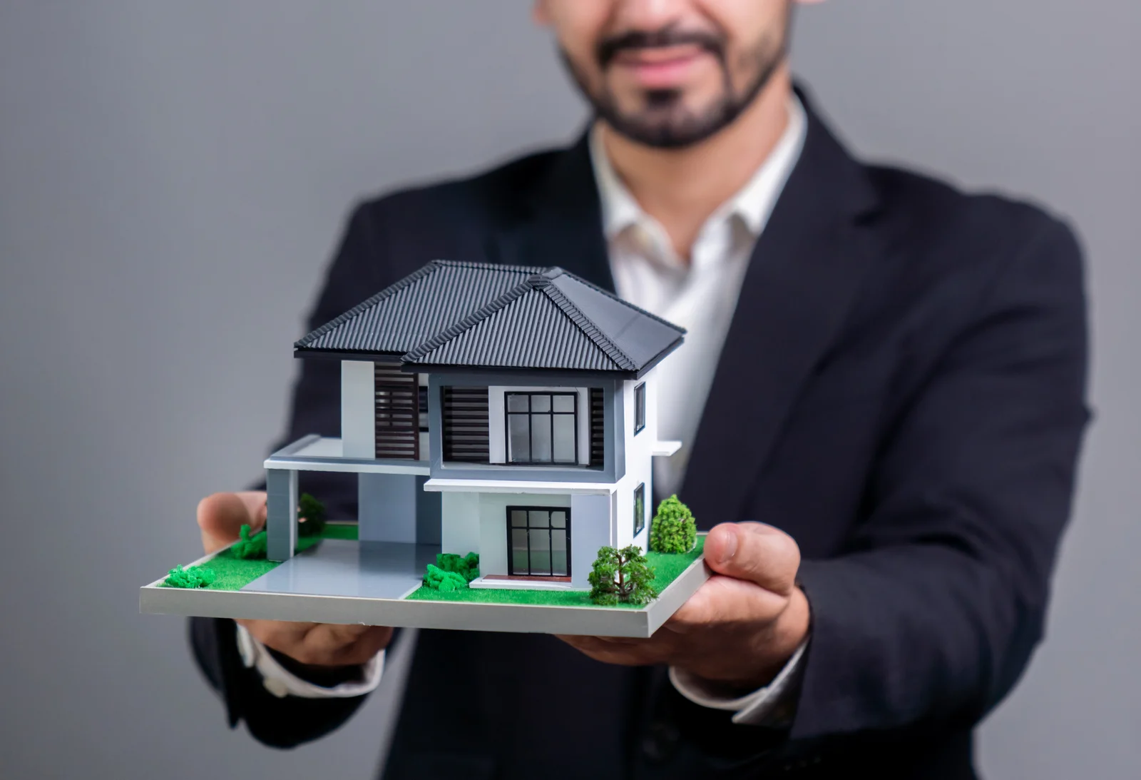 Realtor presenting property investment opportunity on house loan idea